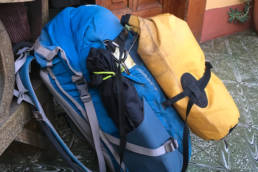 Blue backpack with yellow drybag on top